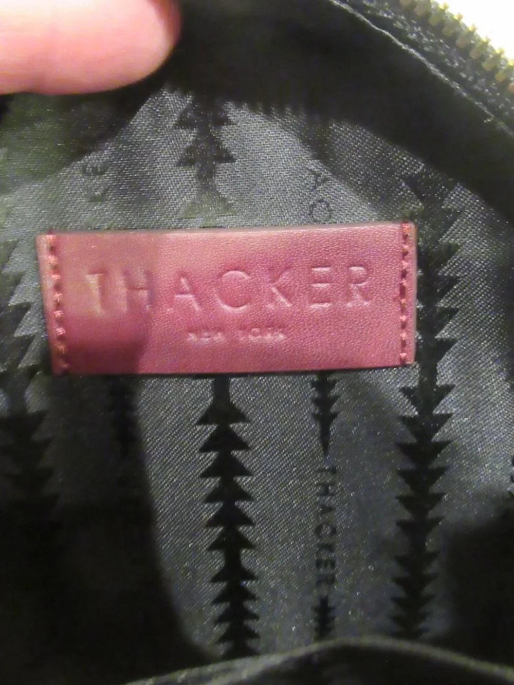 Thacker burgundy purse, both a crossbody and a bracelet handle